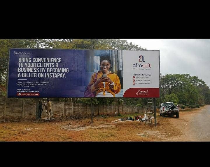 Afrosoft InstaPay billboard being installed by the Zariel Advertising crew